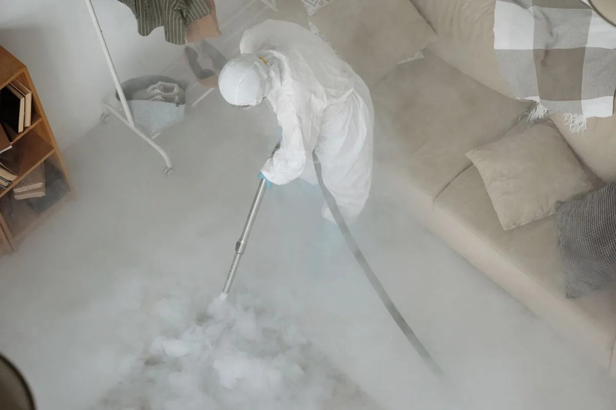 Biohazard cleanup technician in protective equipment, Sturgeon, PA